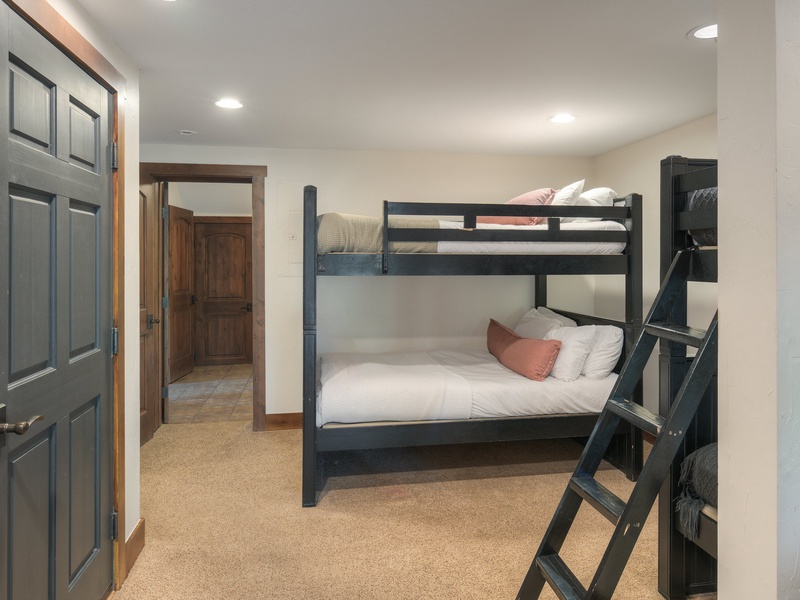 Seventh Bedroom (Level 1): One twin-over twin bunk bed one twin-over-full bunk bed; covered terrace access, and TV.