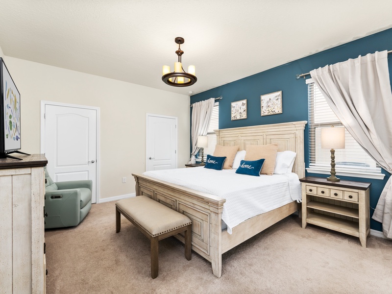 Our master bedroom features its own private bathroom with access to the pool area.