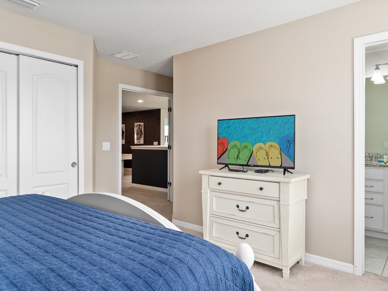This bedroom comes with its own TV, private bathroom and closet space.
