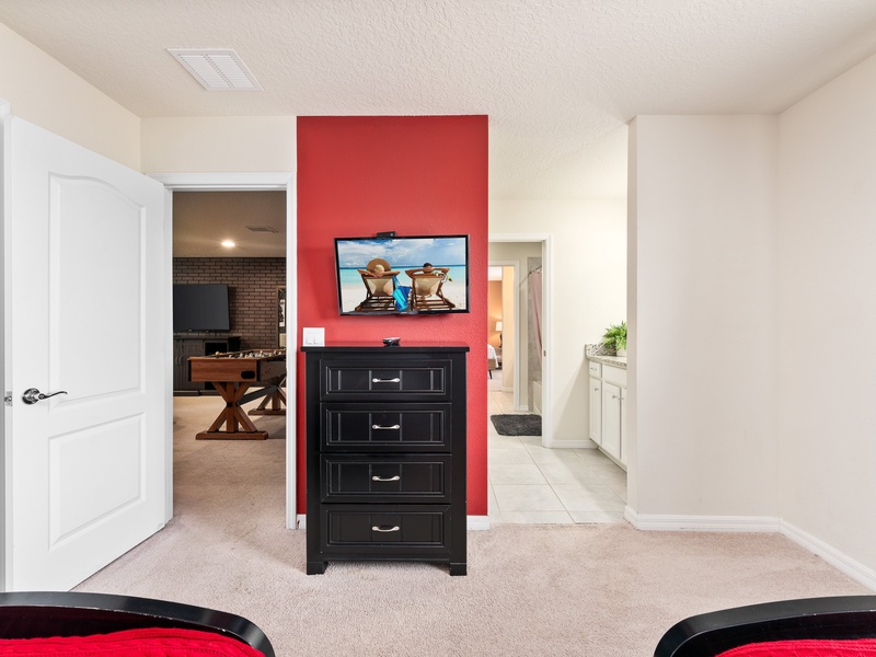 This bedroom comes with its own TV, closet space and semi private bathroom.