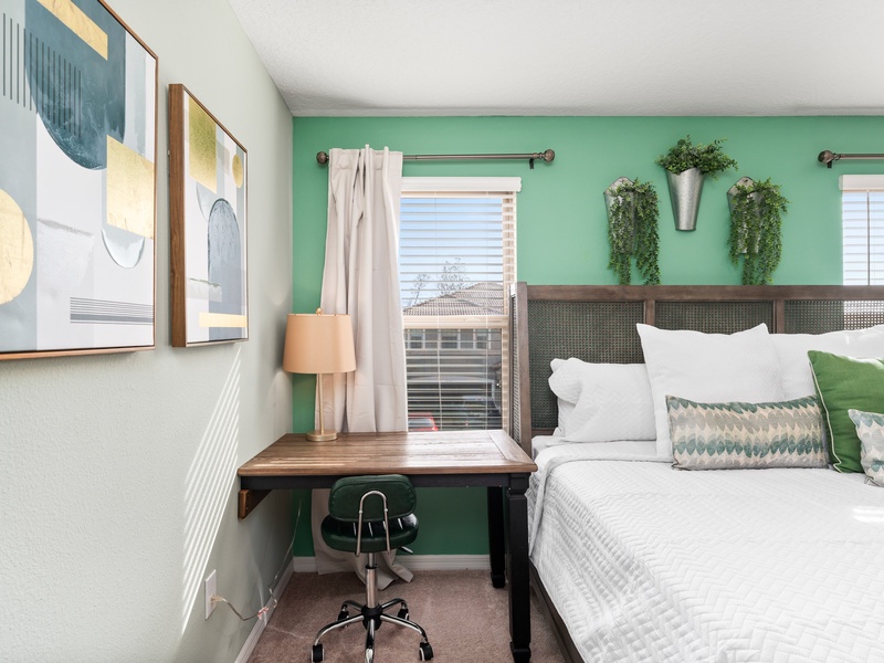 This bedroom also features a workspace, perfect for getting some work done during the holidays.
