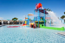 Let your children enjoy at the splash pad while you relax by the cabanas.