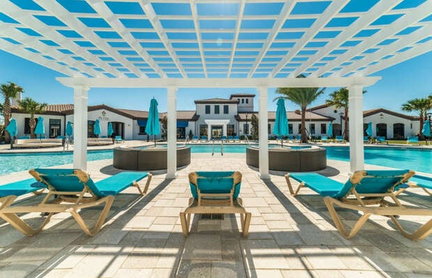 Let your children enjoy the splash pad while you relax in the cabanas.
