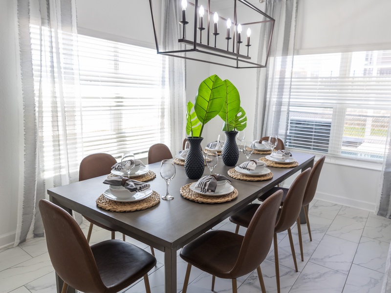 Comfortable dining room with seating for 8, plus 4 more at the kitchen bar for casual dining.