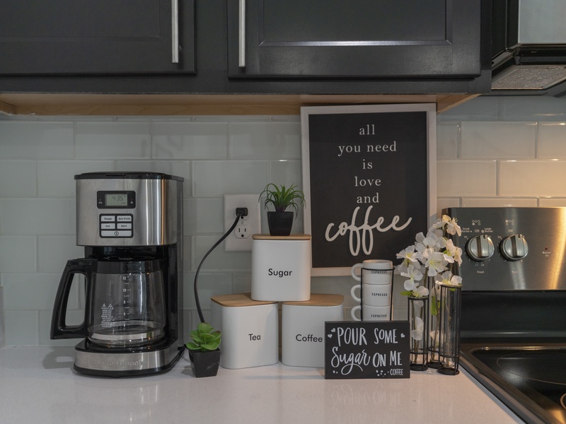 Fully equipped kitchen featuring sleek stainless steel appliances.