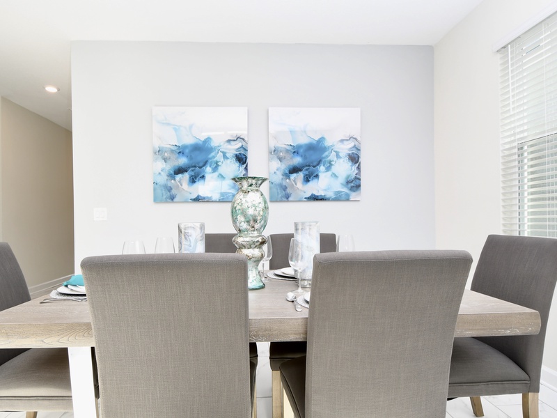 Comfortable dining room with seating for 6, plus 3 more at the kitchen bar for casual dining.