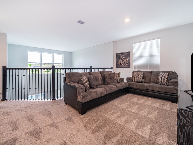 Enjoy a cozy movie night with ample plush seating.