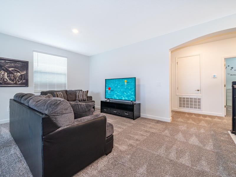 Enjoy a cozy movie night with ample plush seating.