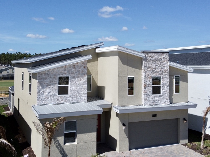 Four parking spaces are available in the driveway and garage. Additional guest parking is also available near the house.