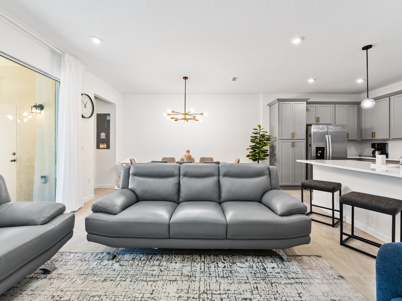 Enjoy a movie night in our cozy living room, complete with a large-screen TV and comfortable plush seating.