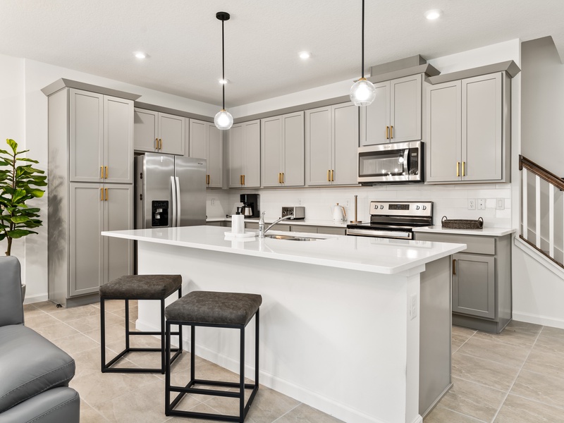 The kitchen features stainless steel appliances.