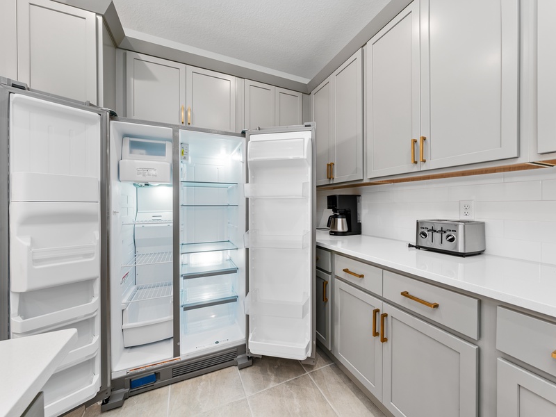The kitchen features stainless steel appliances.