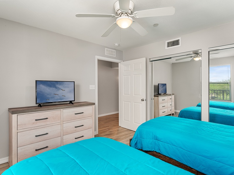 Each bedroom includes a TV and closet space for your convenience.