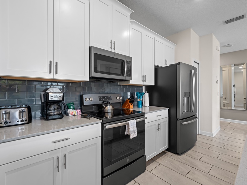 Fully equipped kitchen featuring stainless steel appliances.