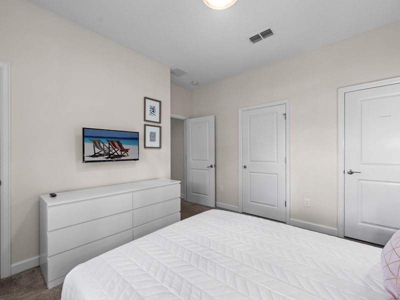 Each bedroom is equipped with its own TV and ample closet space for your convenience.