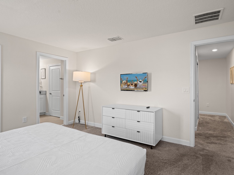 Each bedroom is equipped with its own TV and ample closet space for your convenience.