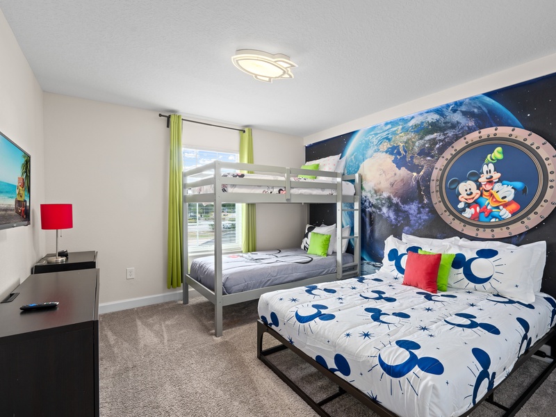 The children's room features comfortable accommodations with a full shared bathroom for added convenience.