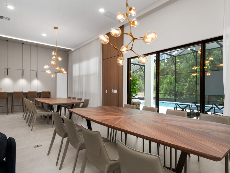 Our dining area features two beautifully designed tables that seat large groups comfortably. You'll also find a convenient bar-height counter with additional seating.