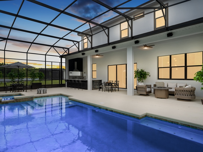 Enjoy lovely evenings outside by the private pool.