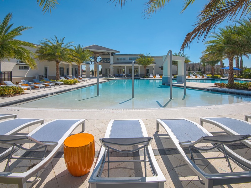 Enjoy the resort-style pool with lounge chairs and cabanas, perfect for soaking up the Florida sun.