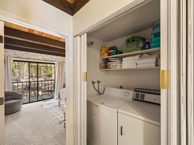 A full sized washer and dryer is located on the ground level