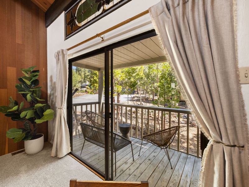 Enjoy a private balcony off the main living space with comfortable seating