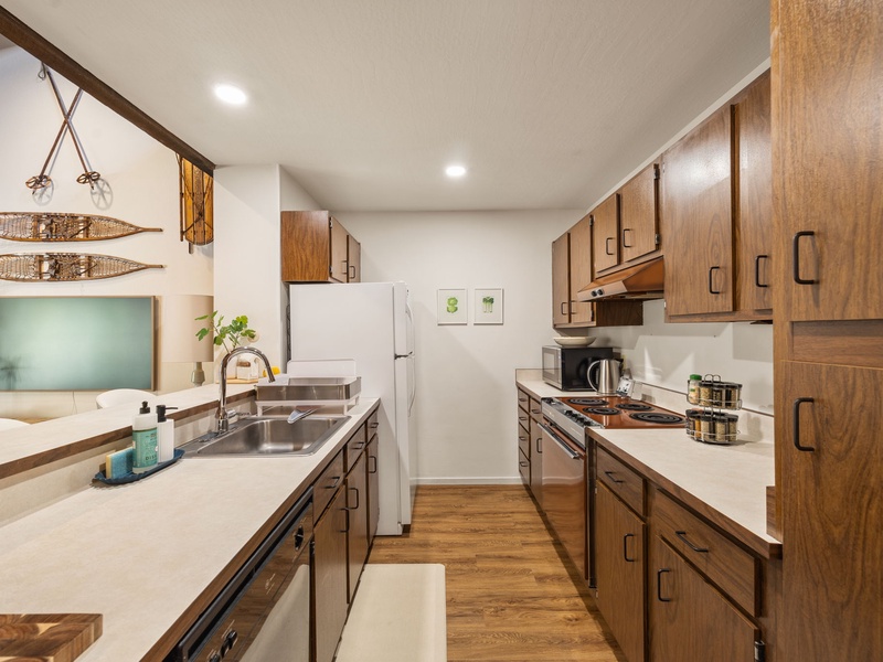 A galley kitchen offers ample prep space and kitchen amenities