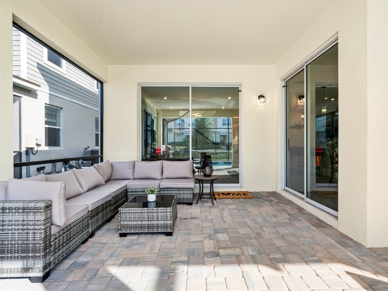 Unwind by the private pool at night in your cozy outdoor living room.