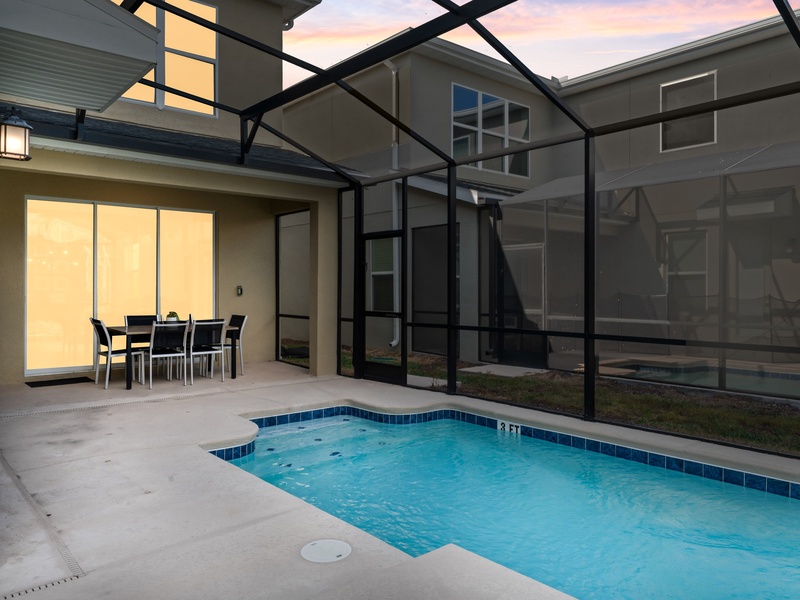 Unwind by the private pool at night in your cozy outdoor living room.