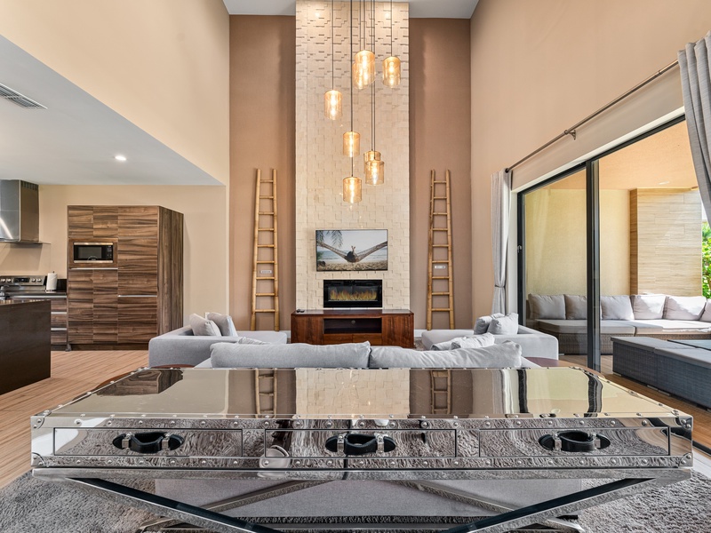 Unwind and enjoy cozy family time by the indoor fire pit, perfect for creating warm memories after a day at the parks.