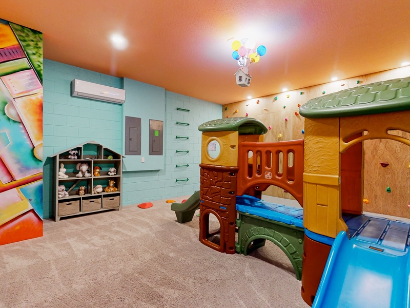 Converted garage to child's play space.  Rock wall climbing, wall rung climbing, toddler climber, toddler wall activity, TV