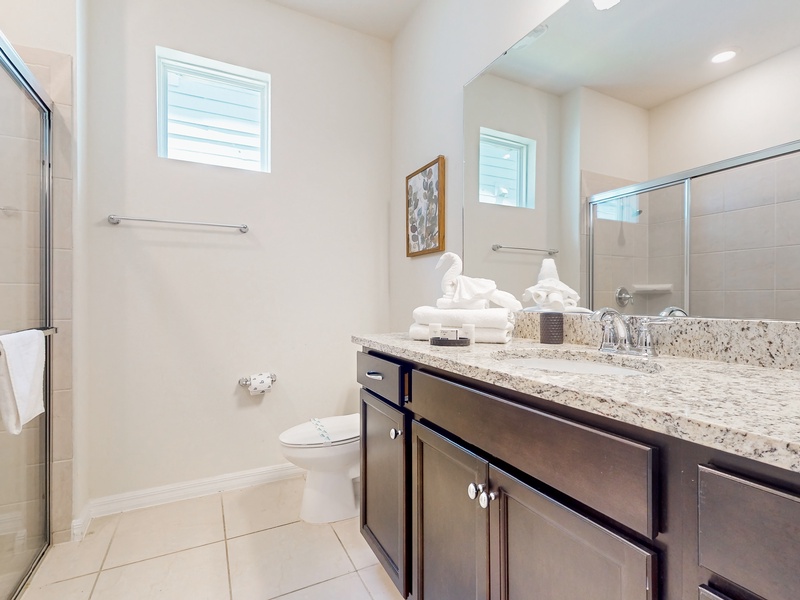 1st floor shared bathroom located at the front of the home with walk in shower
