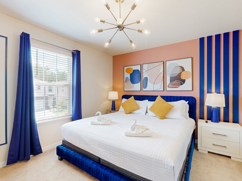 2nd floor additional King bedroom located at the front of the home.  Walk in closet & TV.  Has in room access to Jack & Jill bathroom that is shared with the Encanto bedroom