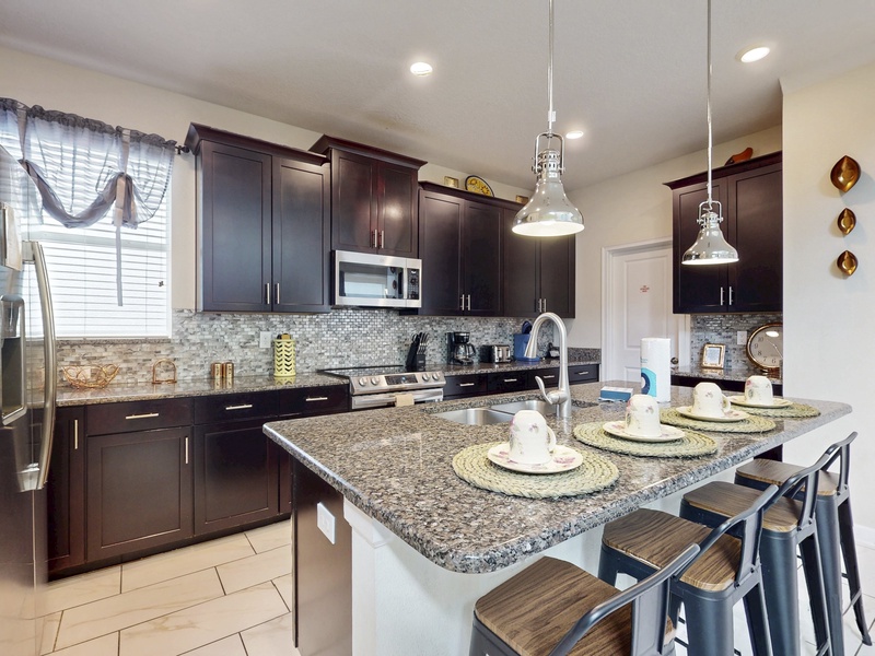 A fully equipped kitchen makes dining in easy for the whole group.