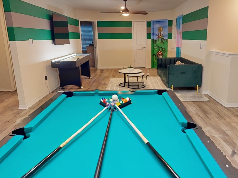 2nd floor recreation area with pool table, shuffleboard & TV