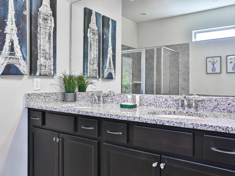 Bedroom #2 - private ensuite with double sink vanity, soaking tub, walk in shower, toilet closet, and access to lanai.