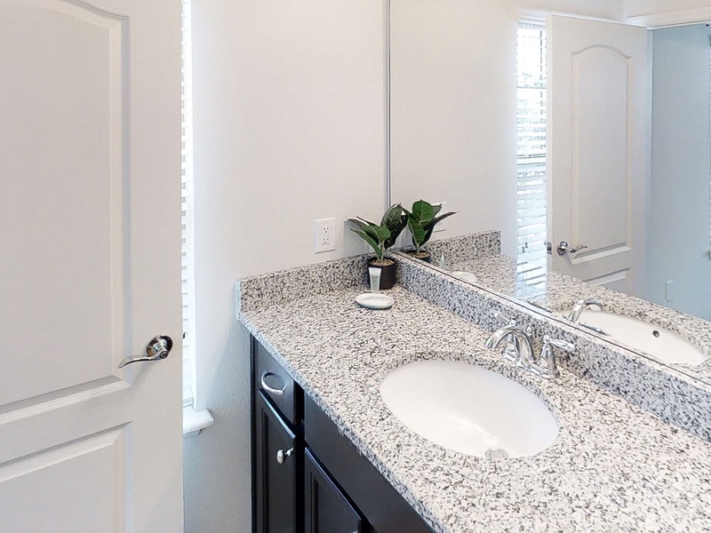 Bedroom #5 - private ensuite with single sink vanity, toilet & walk in shower.