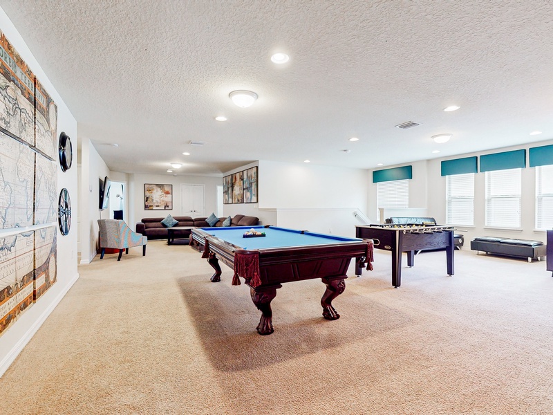 2nd floor recreation area with pool table and foosball table