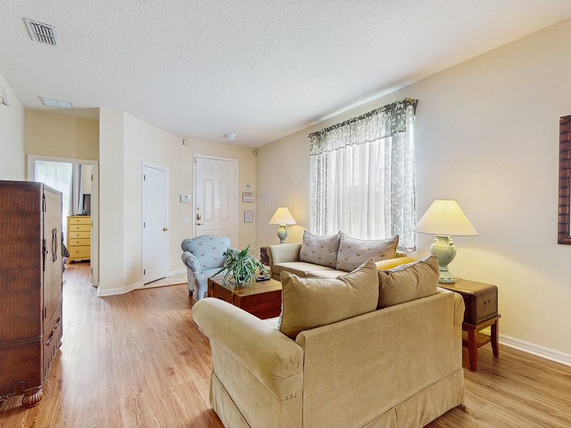 Formal seating area in front of home with small ROKU tv