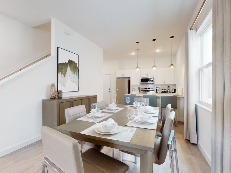 The dining area and kitchen seamlessly blend into one cohesive space.