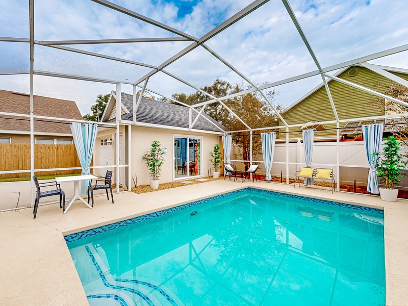 Large private pool with seating & small dining table