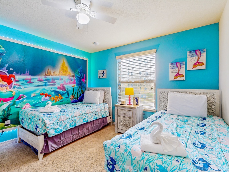 Bedroom #6 Little Mermaid bedroom with 2 twin beds, TV & walk in closet.