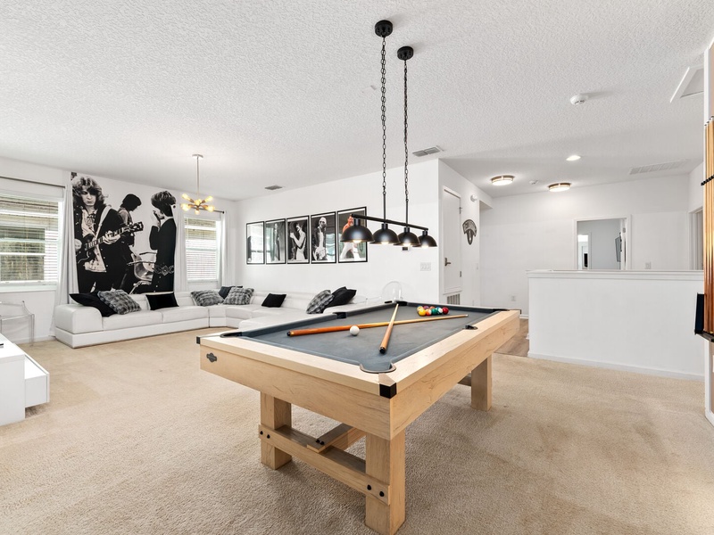 The house also features an additional TV room with a pool table!