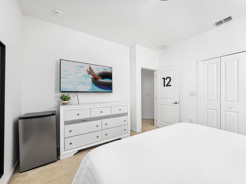 Featuring its own TV, mini bar fridge and a full shared bathroom.