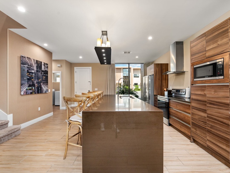 Our kitchen is fully equipped with new stainless steel appliances, cookware, and utensils, perfect for preparing your favorite meals during your stay.