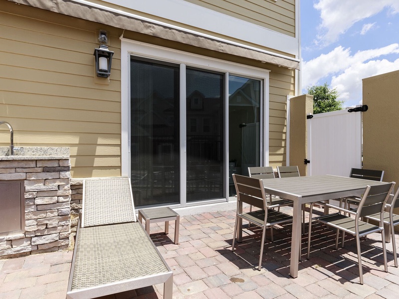 Enjoy a cozy patio complete with BBQ grill, sun loungers, and a private hot tub, ideal for relaxing evenings after a day at the parks.
