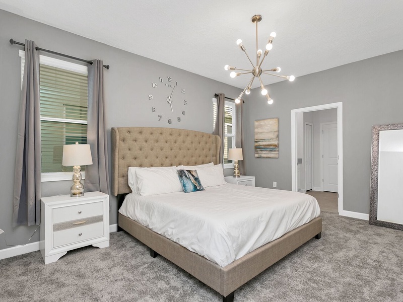 Our master bedroom features its own private bathroom, TV, closet and access to the pool.