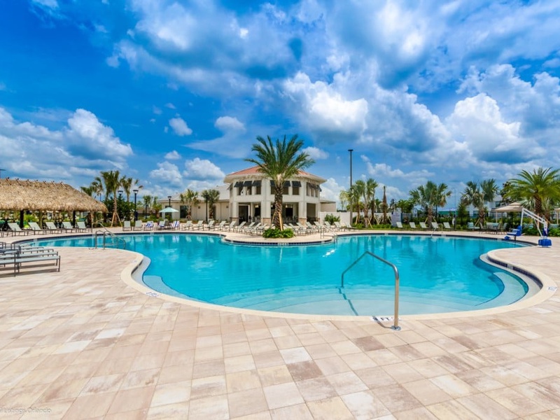 Storey Lake features a beautiful swimming pool with multiple lounge chairs and cabanas, perfect for basking in the sun.