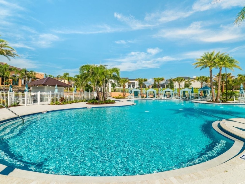 Bask in the sun by Solara Resort's stunning pool, complete with cabanas, splash zones, and tropical vibes.