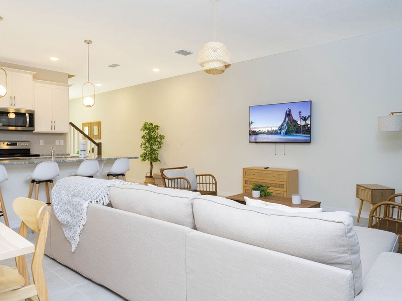 Enjoy a movie night in our living room with ample plush seating.